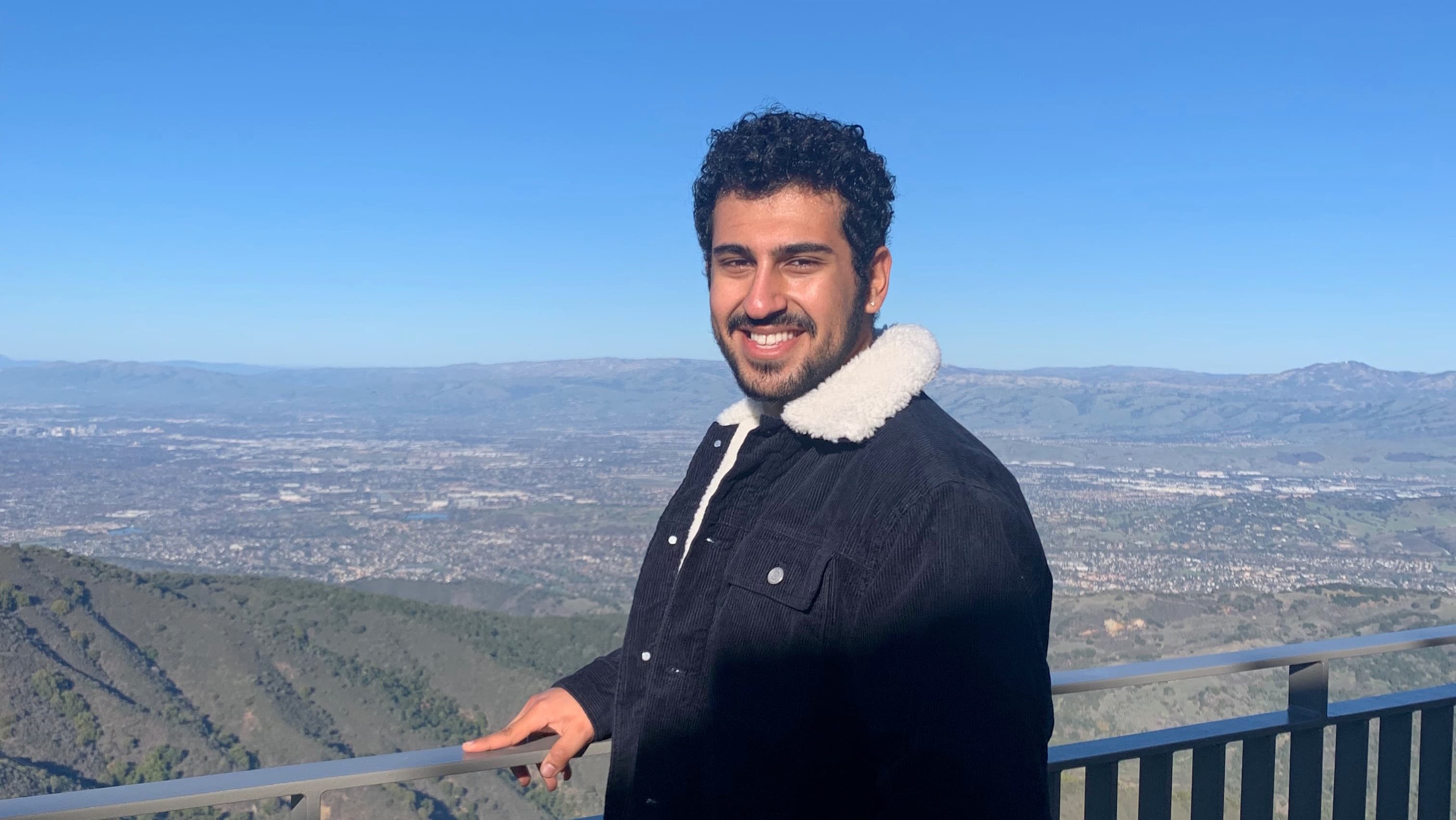 Rashid Al Abri posing in front of Umunhum, California.